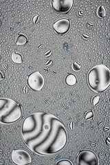 Black and White Oil and Water Abstract Wallpaper Background Texture. Oil Bubbles and blobs containing lots of bright vibrant beautiful designs. Unique fun image.