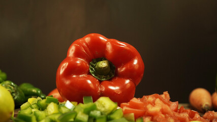 fresh vegetables in the kitchen ready to cut, carrots, peppers, lemons, tomatoes, cucumbers and other vegetables on a cutting board