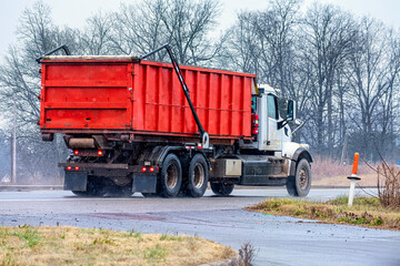 Dump Truck Driving In Mixed Rain and Snow