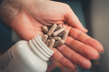 person holding pills