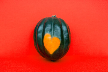 green pumpkin and heart-shaped spot. natural uniqueness love sign 