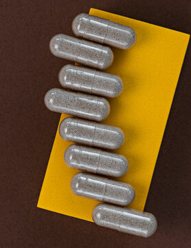 close-up of slippery elm capsules. dietary concept. dietary supplement topview.