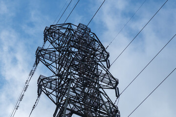 Overhead electrical tower with connected power lines 
