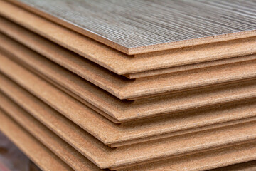 A stack of laminate flooring. Laminate flooring panels. Floor repair concept.