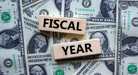Fiscal year symbol. Concept words 'fiscal year' on wooden blocks on a beautiful background from...