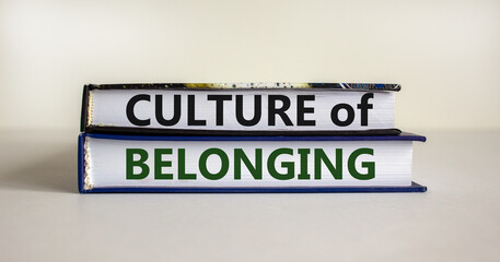 Culture of belonging symbol. Books with words 'culture of belonging' on beautiful white background. Business, culture of belonging concept. Copy space.