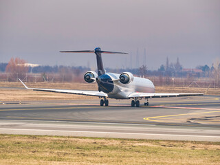 Commercial Passenger aircraft  on the airport runway at Henri Coanda International Airport.