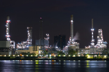 Fototapeta na wymiar Close up oil and gas industrial, Refinery factory oil storage tank and pipeline steel at night