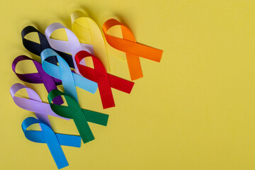 colorful ribbons from disease prevention campaigns. space for text.