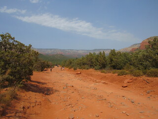 View from the Devil's Bridge trail on a sunny summer day located in Sedona, Arizona with red rock scenery 