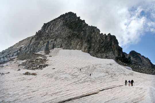 Mountaineers climbing at Mount Pico de Aneto in Huesca, Spain. Pico de Aneto is the highest mountain in Pyrenees at 3404 meters.