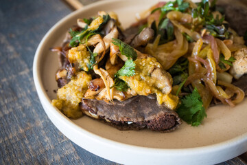 Vegan Mexican Food - featuring a cauliflower taco and a bean empanada topped with mushrooms