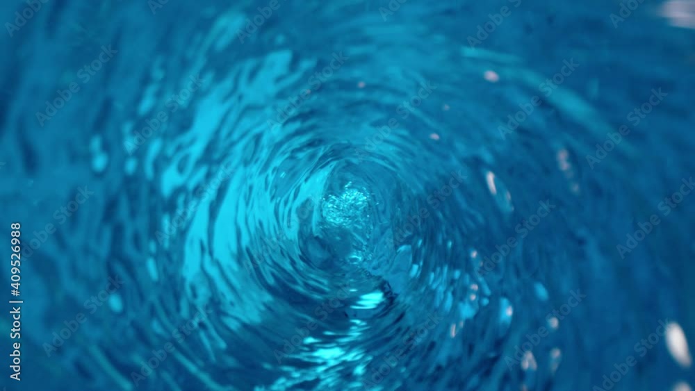 Poster super slow motion of rotating water in twister shape with zoom camera movement. filmed on high speed