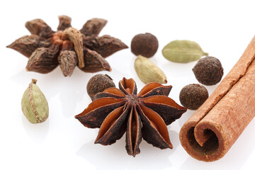 Spices for winter dishes, isolated on white background . Mulled wine or ingredients for seasonal Christmas baking are aromatic spices. Close-up
