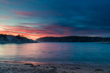 Colourful High Cloud Sunrise Seascape and Rock Formations