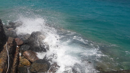 waves breaking on rocks
