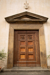 Entrance to a historic building with large heavy timber doors