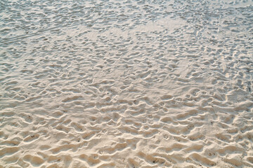 Top view of sandy beach.Background with copy space and visible dirty sand texture