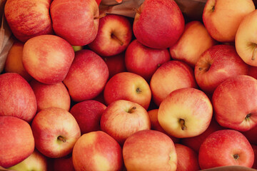 Red and yellow apples in a basket at the market