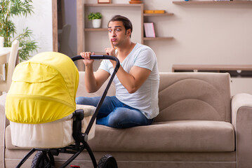 Young male contractor looking after new born at home