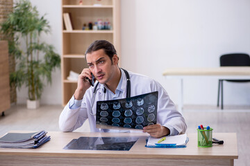 Young male doctor radiologist working in the clinic