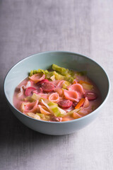 pasta with hotdog, chicken, carrots, onion and cabbage in milk soup also known as Sopas or Filipino macaroni soup; a comfort food in the Philippines