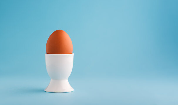 chicken egg in white ceramic egg cup
