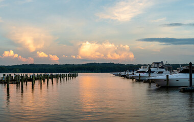 Fototapeta na wymiar Marina at Sunset with Golden Clouds on Calm Water on the Potomac River, Maryland