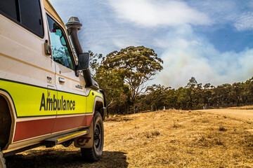 An offroad fourwheel drive ambulance at a bushfire © Michael McClean