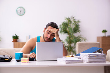 Young man working from house during pandemic