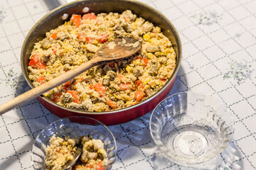 Farofa: typical brazilian dish. Toasted cassava flour, fried meat, chopped spring onions, banana, onion, tomatoes, garlic and basil.