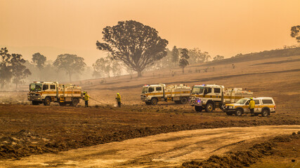 Firetrucks and Firefighters at a grassfire in Australia © Michael McClean