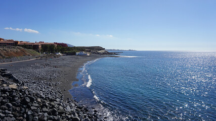 La Enramada beach view from above n La Caleta, Tenerife, Canary Islands, Spain. Pebble beach on a sunny day.           
