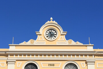 train station clock with blue sky background