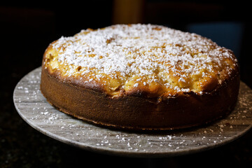 Apple Kefir Cake made with diced apples and kefir topped with powdered sugar
