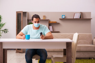 Young man boring at home during pandemic