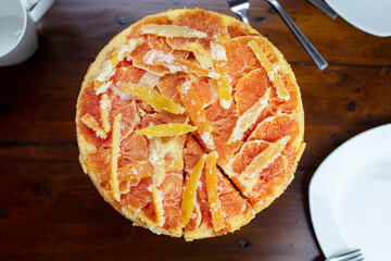 Orange Upside Down Cake with Candied Orange and Lemon Rind on a Plate