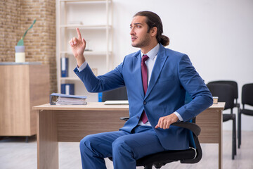 Young businessman making presentation during pandemic