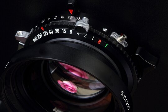 camera lens on black - Powered by Adobe