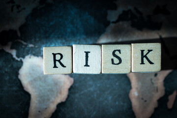 Wooden cube block showing ”RISK” wording