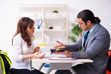 Young businessman and female architect discussing new project