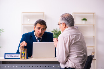 Young male lawyer and old man in testament and time management c