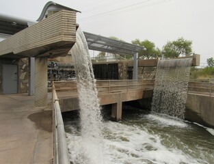 The restored hydroelectric plant in Phoenix with small waterfalls called Arizona Falls on a cloudy day  © Isabel