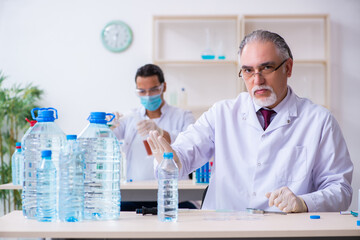 Two chemists working in the lab