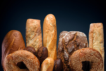Different kinds of bread dark background