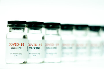 vials of covid-19 vaccine in a row
