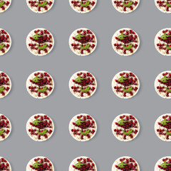 Seamless pattern from galettHealthy breakfast with rice cake and pomegranate on grey flat lay.