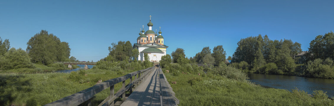 Summer panorama with the ancient cathedral of the Smolensk Icon of the Mother of God. Olonets, Karelia