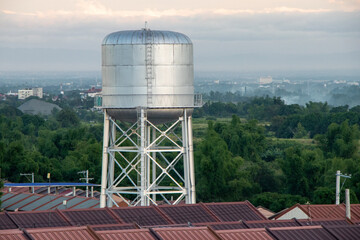 Steel Water Tower in Asian Village at Sunset - Angeles City, Pampanga, Luzon, Philippines