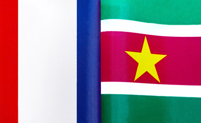 fragments of the national flags of France and the Republic of Suriname close-up